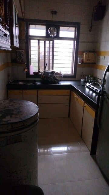 Kitchen in 1 BHK Apartment at Raj Tarang, Dahisar East – for Sale