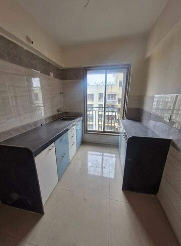 Kitchen in 2 BHK Apartment at Agarwal And Doshi Complex, Vasai West – for Sale