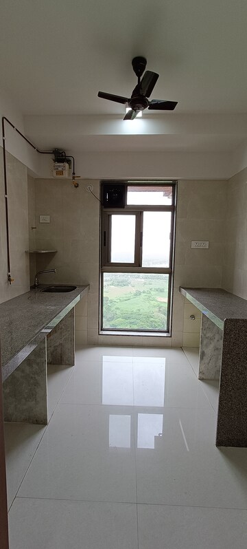 Kitchen in 2 BHK Apartment at Gagangiri Elanza CHS, Mulund East – for Sale