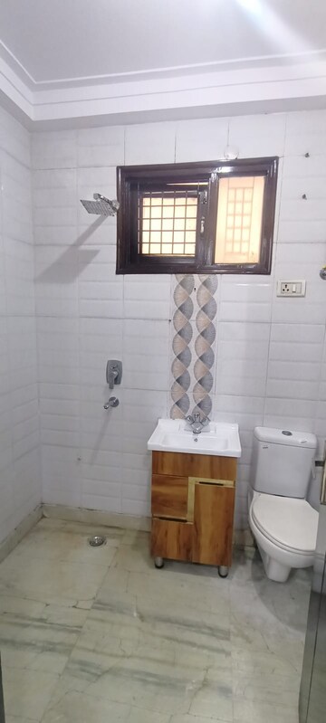 Bathroom in 4 BHK Builder Floor at Mahavir Enclave – for Sale