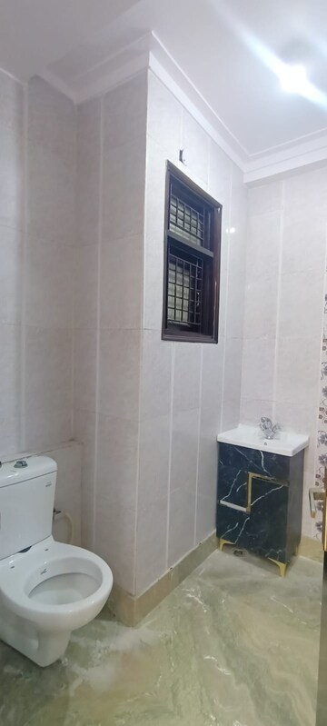 Bathroom in 4 BHK Builder Floor at Mahavir Enclave – for Sale