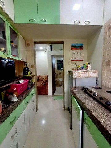 Kitchen in 2 BHK Apartment at Parsik Nagar – for Sale