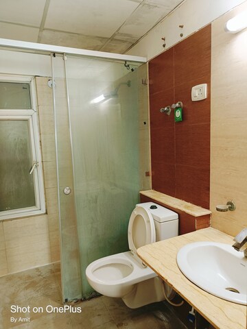 Bathroom in 3 BHK Apartment at Mahagun Moderne, Sector 78 – for Sale