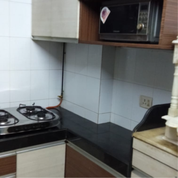 Kitchen in 1 BHK Apartment at Happy Home Estate, Sector 10 – for Sale