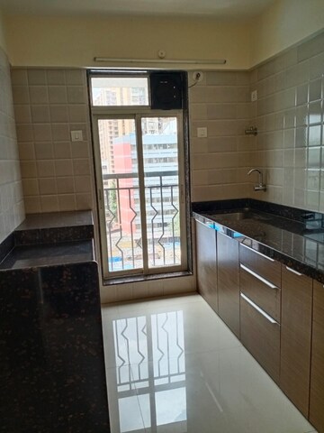 Kitchen in 1 BHK Apartment at Crescent sky Heights, Dahisar East – for Sale