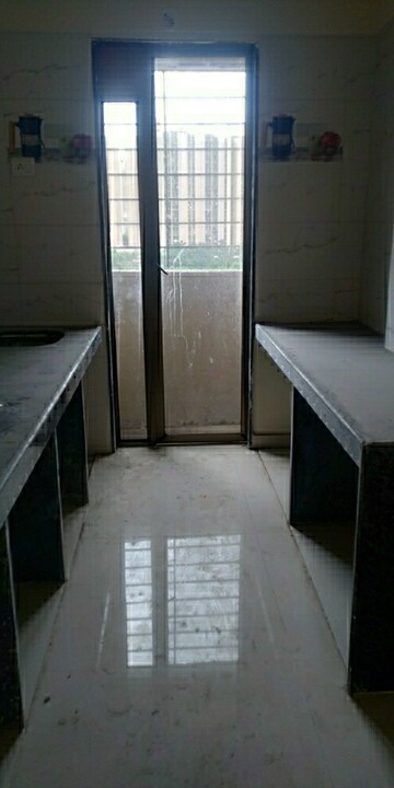 Kitchen in 2 BHK Apartment at Sri Dutt Garden Avenue K, Virar West – for Sale