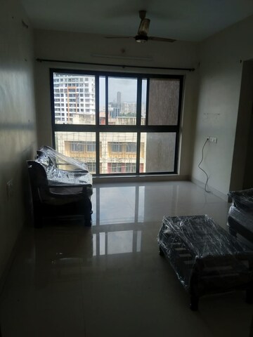 Living Room in 2 BHK Apartment at Rustomjee Meridian, Kandivali West – for Sale