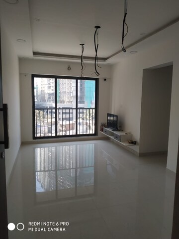 Living Room in 1 BHK Apartment at Parinee Essence, Kandivali West – for Sale