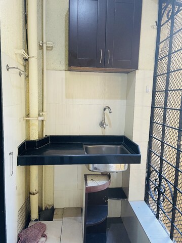 Kitchen in 3 BHK Apartment at Bredco New Viceroy Park , Kandivali East – for Sale