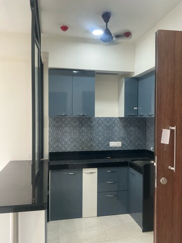 Kitchen in 1 BHK Apartment at Lodha Crown Quality Homes, Balkum Pada – for Sale
