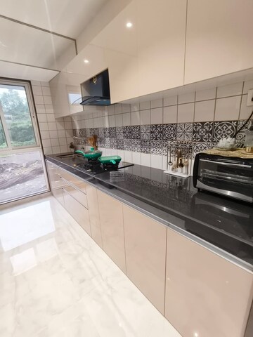 Kitchen in 1 BHK Apartment at Dosti West County, Balkum Pada – for Sale