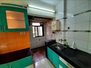Kitchen in 2.5 BHK Apartment at Mulund Anushil, Mulund West – for Sale