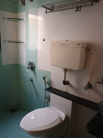 Bathroom in 2 BHK Apartment at Raunak Unnathi Woods Phase 6, Ghodbunder Road – for Sale