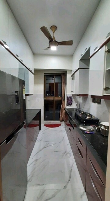 Kitchen in 2 BHK Apartment at Rustomjee Urbania, Majiwada – for Sale
