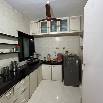 Kitchen in 1 BHK Apartment at River Park Complex, Konkani Pada – for Sale