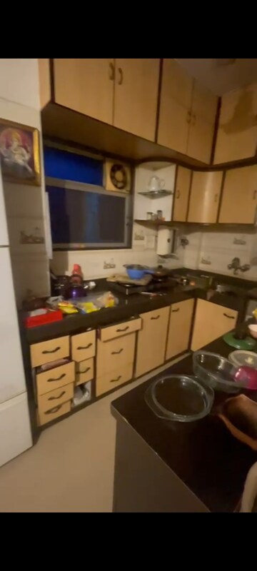 Kitchen in 1 BHK Apartment at Guru Prasad CHSL, Andheri West – for Sale