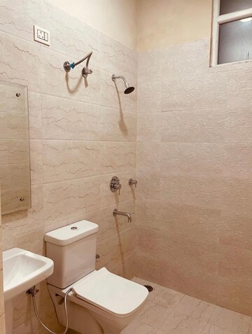 Bathroom in 3 BHK Apartment at Dhakoli Village – for Sale