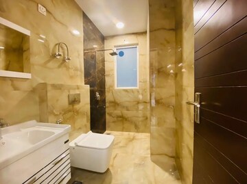 Bathroom in 4 BHK Apartment at Ambience Island Lagoon, Sector 24 – for Sale
