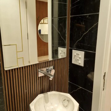 Bathroom in 3 BHK Apartment at Ambience Island Lagoon, Sector 24 – for Sale