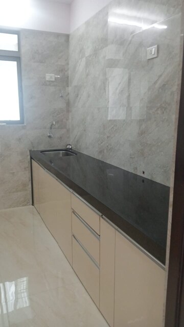 Kitchen in 1 BHK Apartment at Rajesh White City, Kandivali East – for Sale
