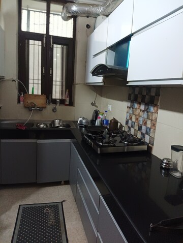 Kitchen in 2 BHK Apartment at Shri Devaji Residency, Dhakoli Village – for Sale