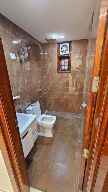Bathroom in 3 BHK Apartment at Mahavir Enclave 1 – for Sale