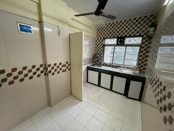 Kitchen in 1 BHK Apartment at Raj Shivam Society, Dahisar East – for Sale