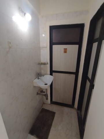 Bathroom in 1 BHK Apartment at Soham Parijat Gardens, Ghodbunder Road – for Sale
