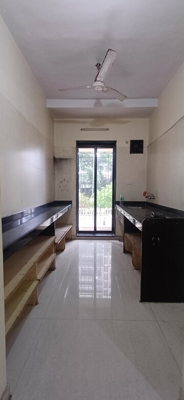 Kitchen in 2 BHK Apartment at Raunak Laxmi Narayan Residency, Pokhran Road No 2 – for Sale