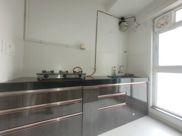 Kitchen in 1.5 BHK Apartment at Godrej Emerald, Ghodbunder Road – for Sale