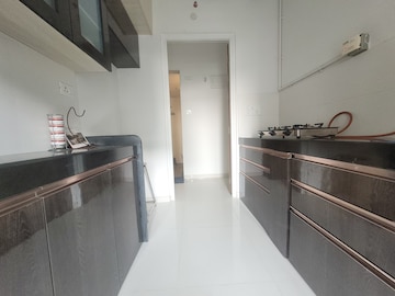 Kitchen in 1.5 BHK Apartment at Godrej Emerald, Ghodbunder Road – for Sale