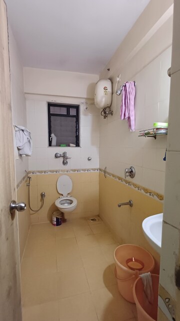 Bathroom in 2 BHK Apartment at Raunak Laxmi Narayan Residency, Pokhran Road No 2 – for Sale