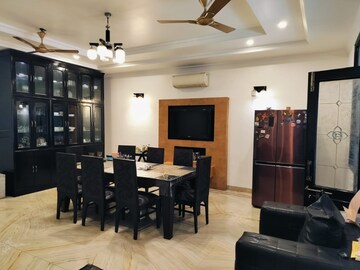 Living Room in 2 BHK Apartment at Amrapali Golf Homes, Sector 4 Greater Noida – for Sale