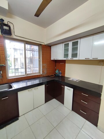 Kitchen in 1 BHK Apartment at Krishna Greenland Park Vastu Federation, Ghodbunder Road – for Sale