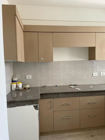 Kitchen in 4 BHK Builder Floor at Puri Aman Vilas, Sector 89 – for Sale