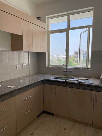Kitchen in 4 BHK Builder Floor at Puri Aman Vilas, Sector 89 – for Sale