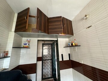 Kitchen in 2 BHK Apartment at Unnati Woods CHS, Kasarvadavali – for Sale