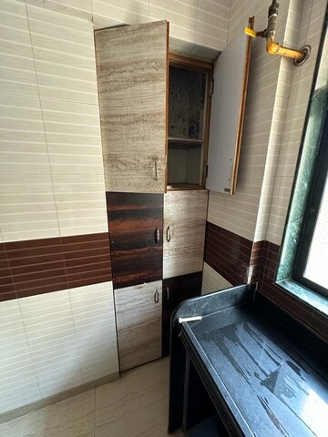 Kitchen in 2 BHK Apartment at Unnati Woods CHS, Kasarvadavali – for Sale