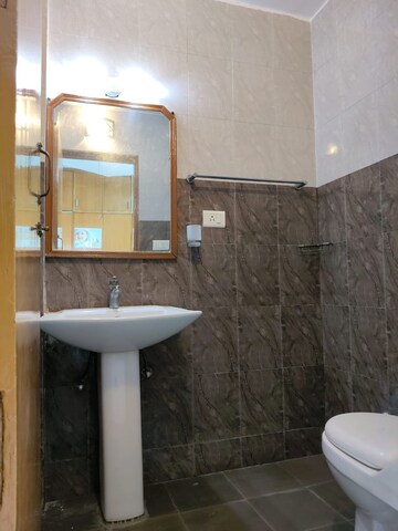Bathroom in 3 BHK Apartment at Mahindra Luminare, Sector 59 – for Sale