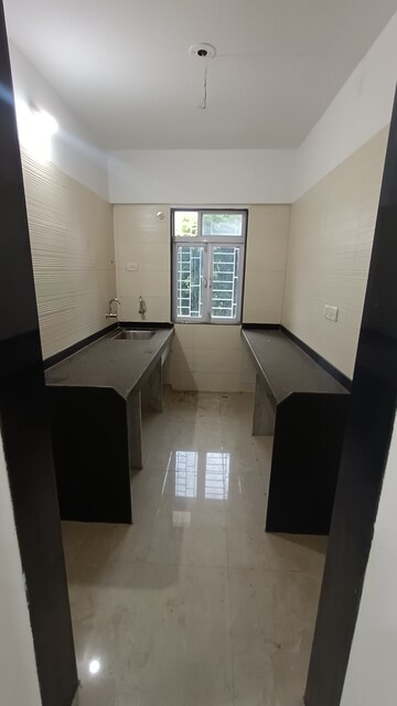 Kitchen in 2 BHK Apartment at Cosmos Classique, Ghodbunder Road – for Sale