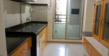 Kitchen in 1 BHK Apartment at Mahavir Kalpavruksha, Ghodbunder Road – for Sale