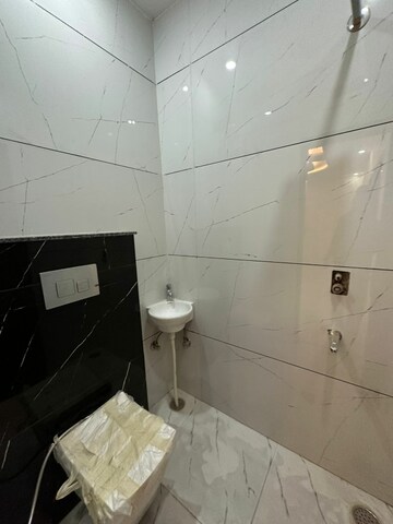 Bathroom in 3 BHK Apartment at Dhakoli Village – for Sale