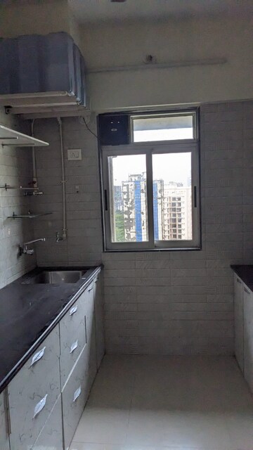 Kitchen in 1 BHK Apartment at Vihang Valley Rio, Kasarvadavali – for Sale