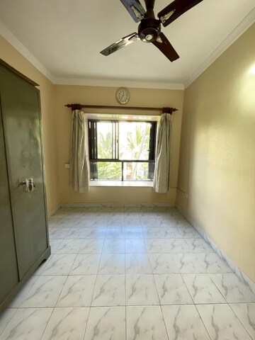 Bedroom in 2 BHK Apartment at Lokhandwala Riviera Tower, Kandivali East – for Sale