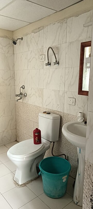 Bathroom in 2.5 BHK Apartment at Aims Golf City, Sector 75 – for Sale