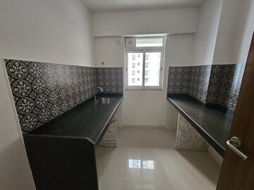 Kitchen in 1 BHK Apartment at Lodha Amara, Kolshet Road – for Sale