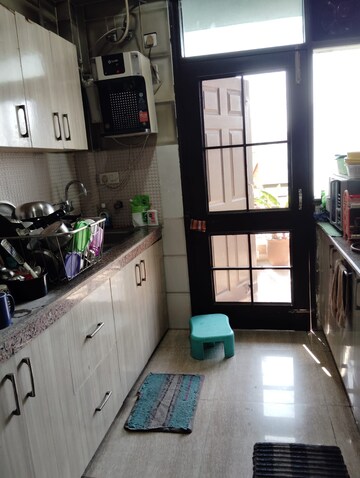 Kitchen in 3 BHK Apartment at New Generation Maple Apartments, Dhakoli Village – for Sale