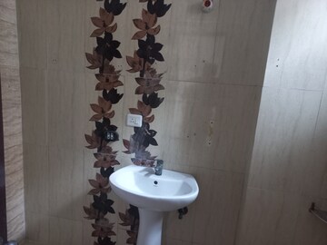 Bathroom in 2.5 BHK Apartment at Prateek Wisteria, Sector 77 – for Sale