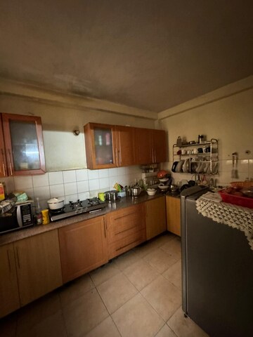 Kitchen in 3.5 BHK Apartment at Sandwoods Spangle Heights, Dhakoli Village – for Sale