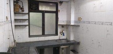Kitchen in 1 BHK Apartment at Gokul Village CHS, Mira Road East – for Sale